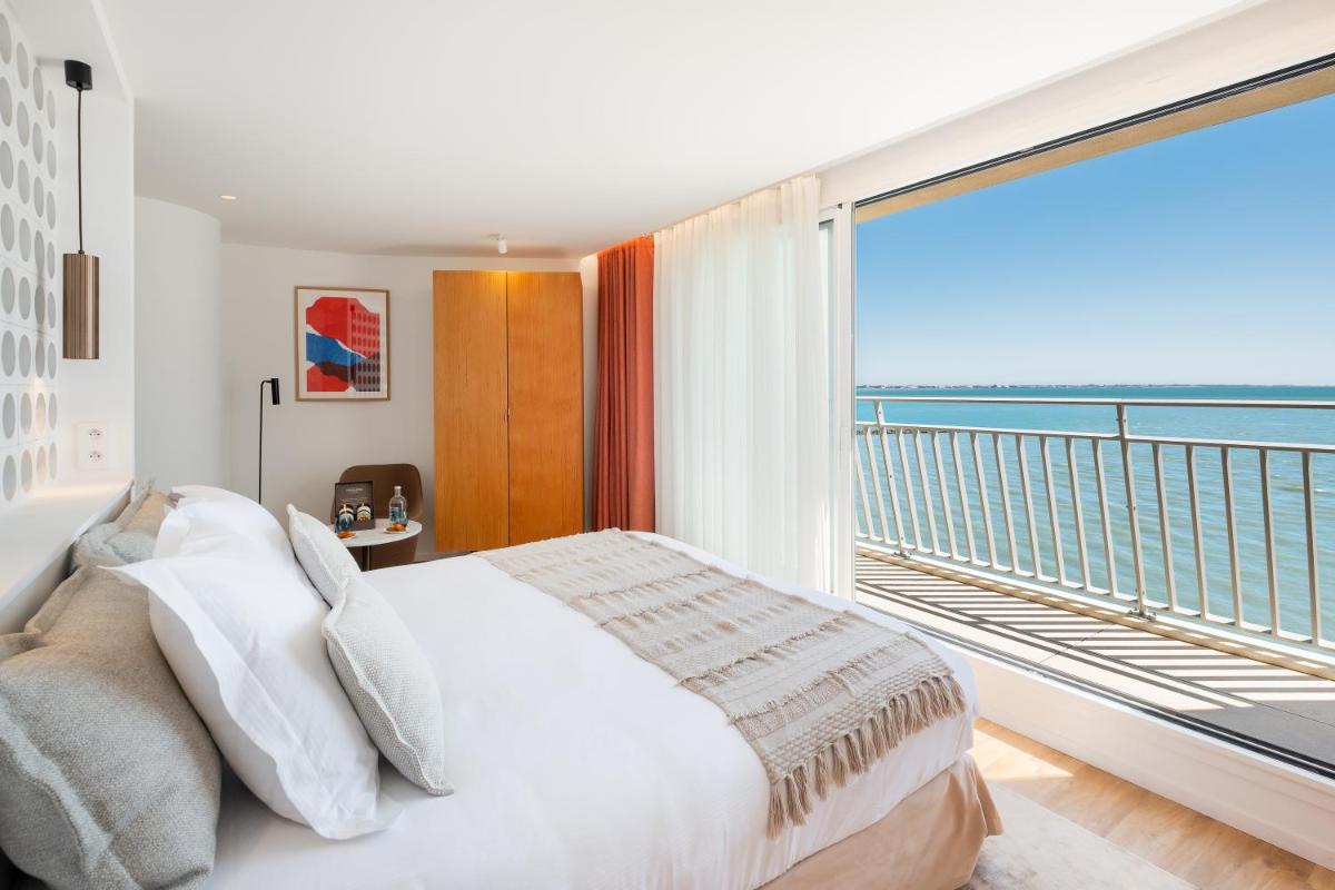 Un ou plusieurs lits dans un hébergement de l'établissement Hôtel La Plage 5 étoiles La Grande Motte