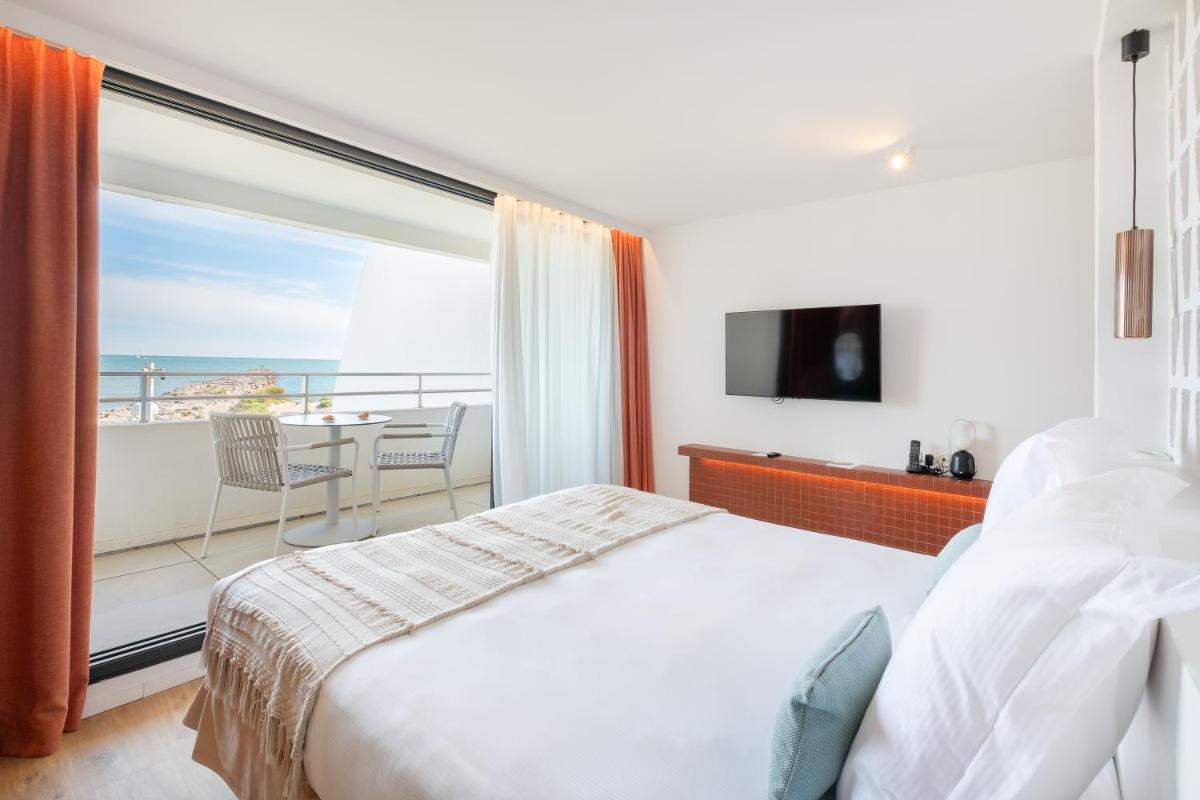 Un ou plusieurs lits dans un hébergement de l'établissement Hôtel La Plage 5 étoiles La Grande Motte