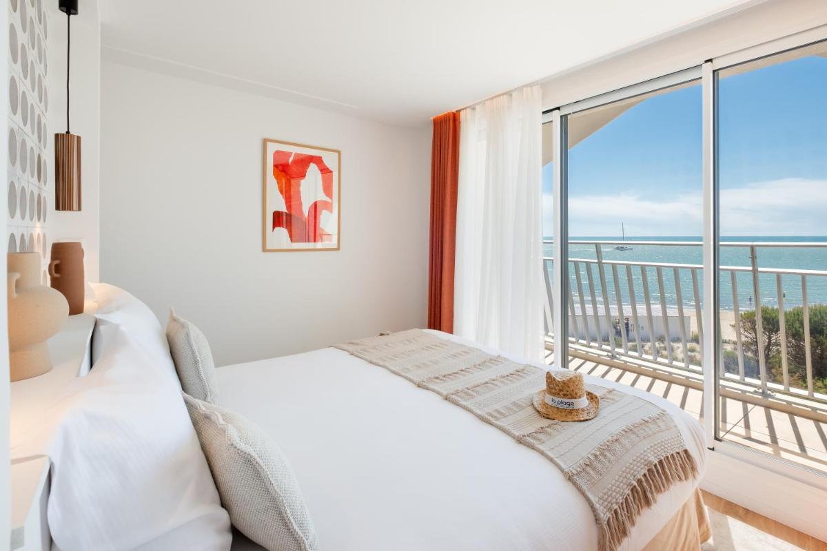Un ou plusieurs lits dans un hébergement de l'établissement Hôtel La Plage 5 étoiles La Grande Motte