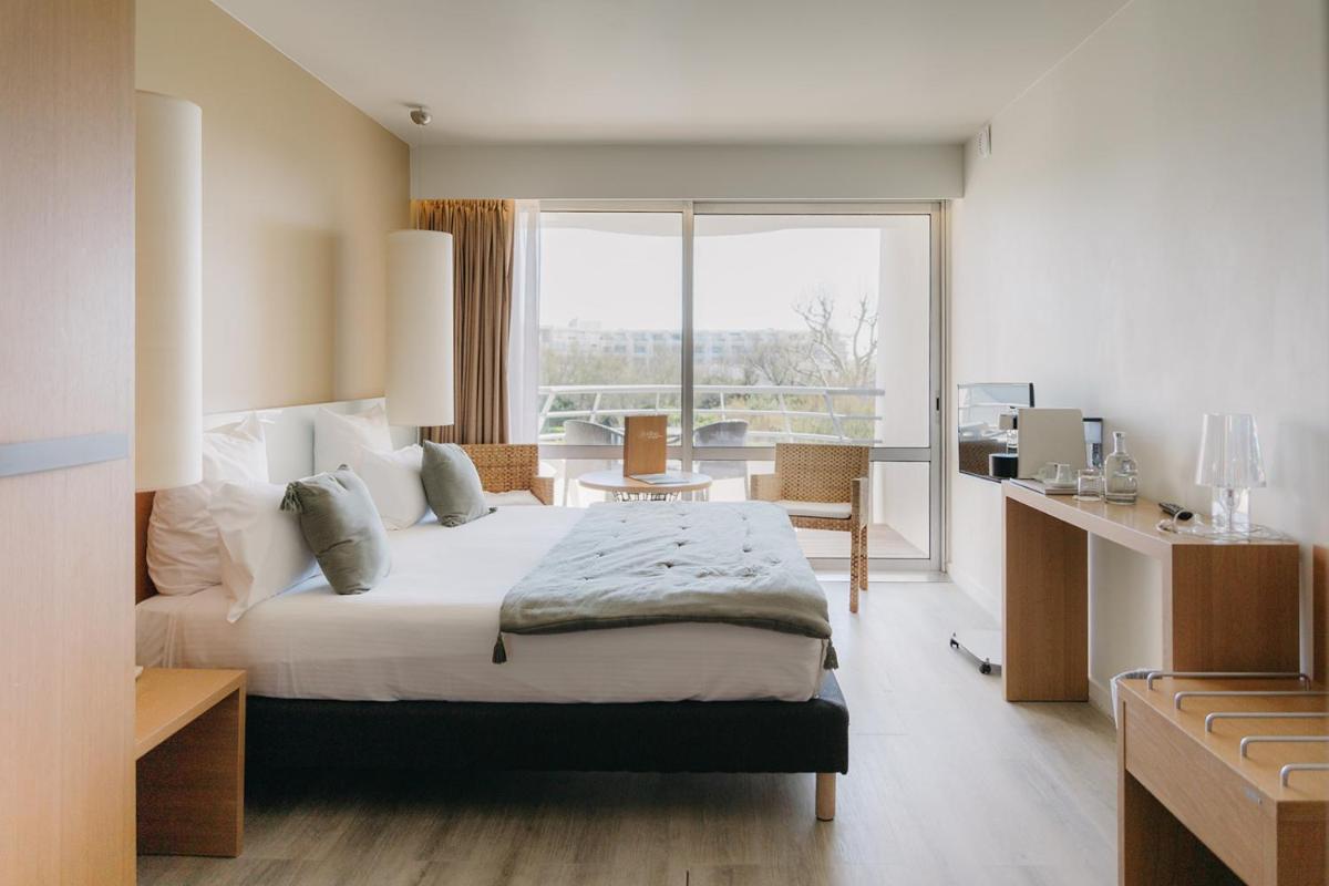 Un ou plusieurs lits dans un hébergement de l'établissement Hôtel Les Corallines - Thalasso & Resort