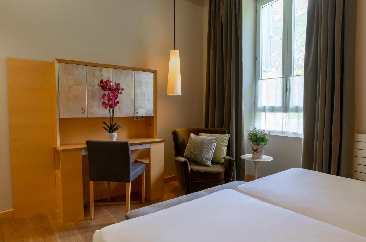 Cama o camas de una habitación en Gran Hotel – Balneario de Panticosa