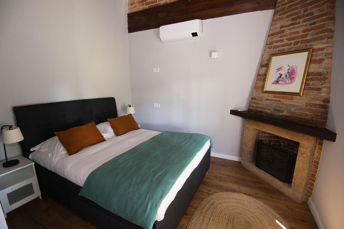 Uma cama ou camas num quarto em Sorraia Hotel Rural