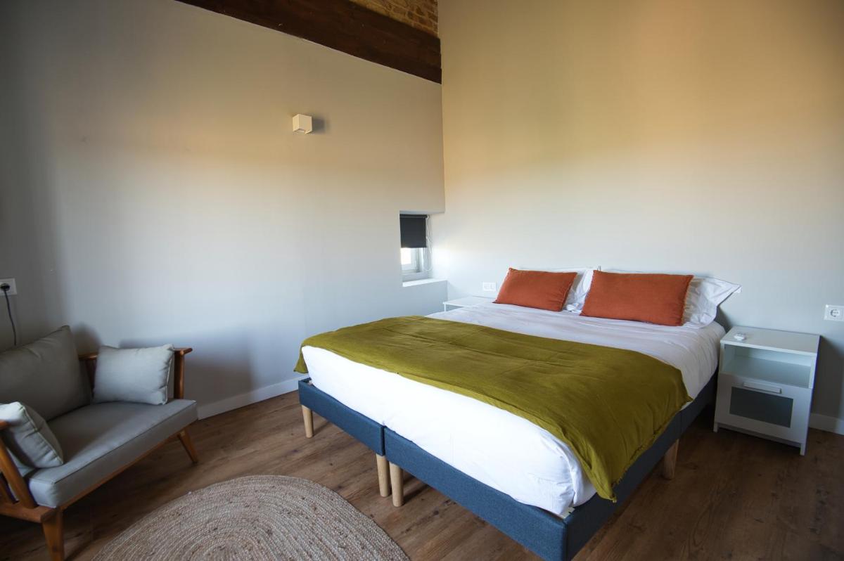 Uma cama ou camas num quarto em Sorraia Hotel Rural