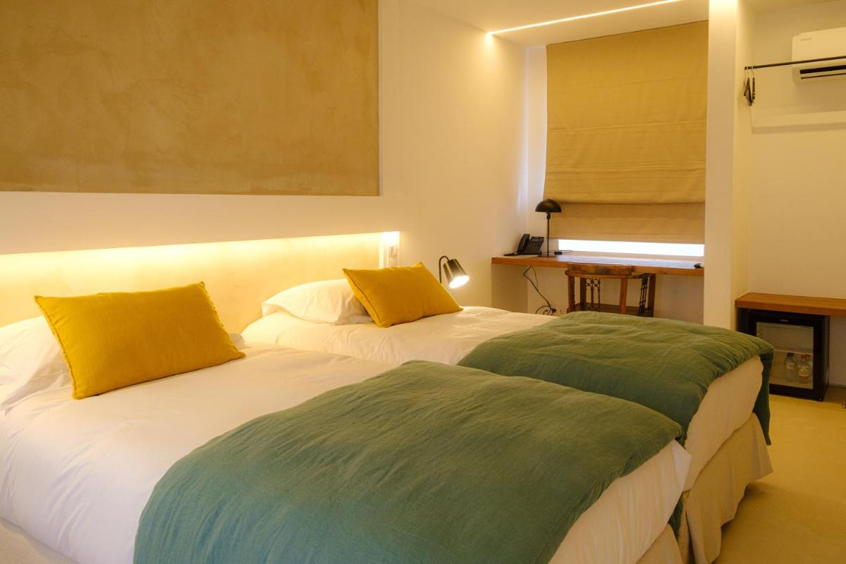 Uma cama ou camas num quarto em Sorraia Hotel Rural