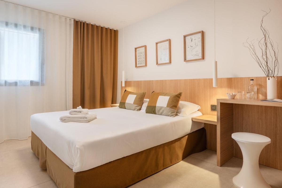 Un ou plusieurs lits dans un hébergement de l'établissement Grand Hotel Du Golfe - Spa & Restaurant