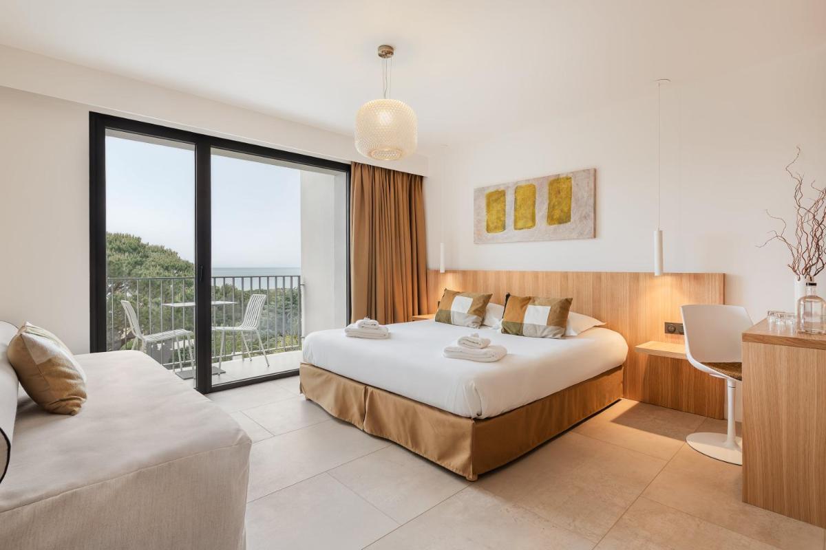 Un ou plusieurs lits dans un hébergement de l'établissement Grand Hotel Du Golfe - Spa & Restaurant