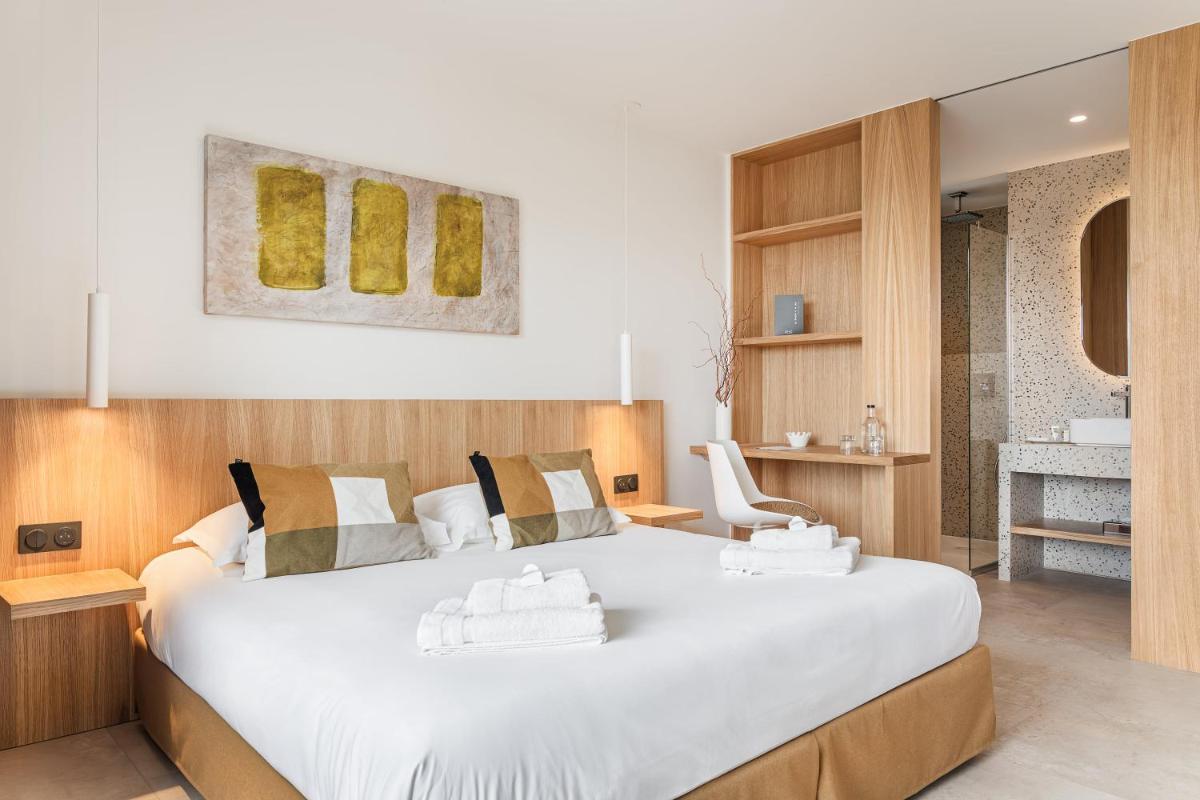 Un ou plusieurs lits dans un hébergement de l'établissement Grand Hotel Du Golfe - Spa & Restaurant