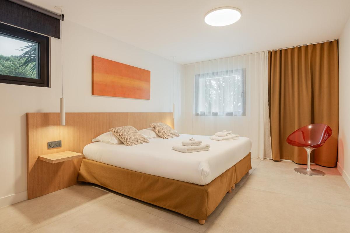 Un ou plusieurs lits dans un hébergement de l'établissement Grand Hotel Du Golfe - Spa & Restaurant