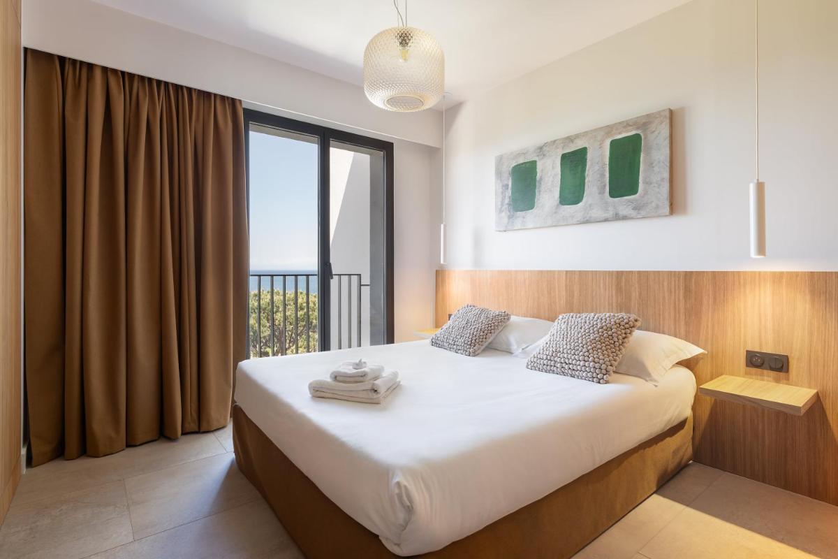 Un ou plusieurs lits dans un hébergement de l'établissement Grand Hotel Du Golfe - Spa & Restaurant