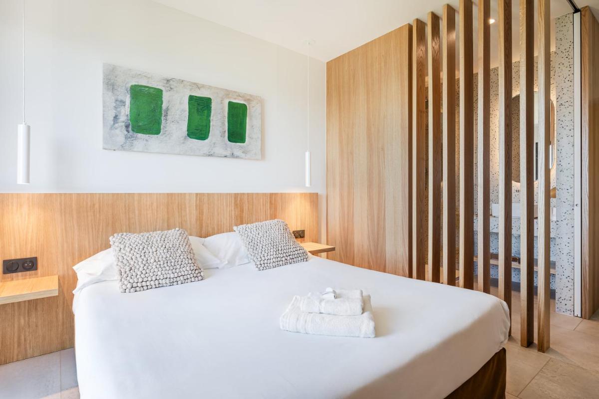 Un ou plusieurs lits dans un hébergement de l'établissement Grand Hotel Du Golfe - Spa & Restaurant