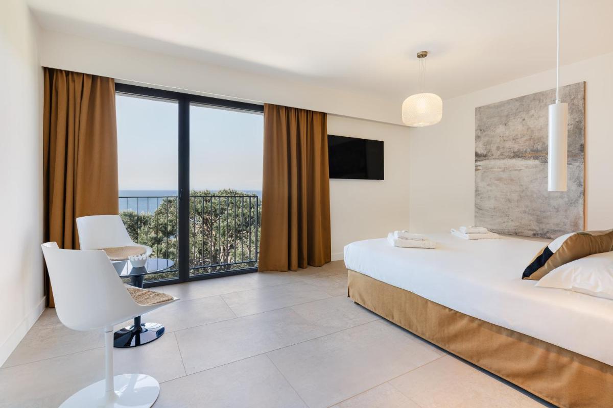 Un ou plusieurs lits dans un hébergement de l'établissement Grand Hotel Du Golfe - Spa & Restaurant