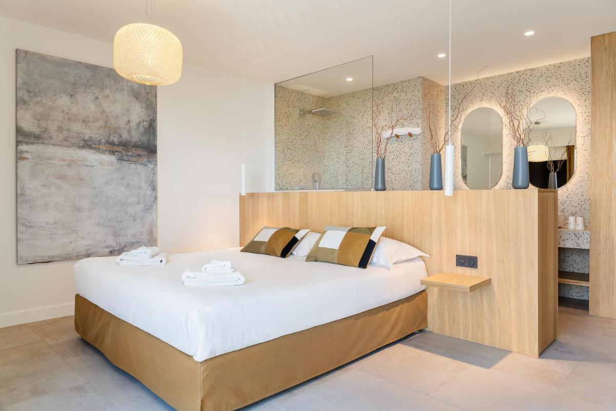 Un ou plusieurs lits dans un hébergement de l'établissement Grand Hotel Du Golfe - Spa & Restaurant