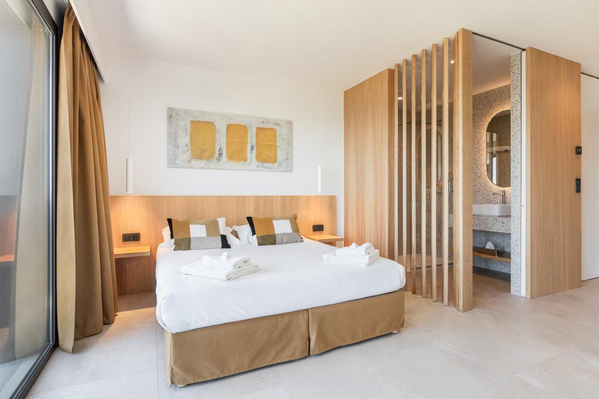Un ou plusieurs lits dans un hébergement de l'établissement Grand Hotel Du Golfe - Spa & Restaurant