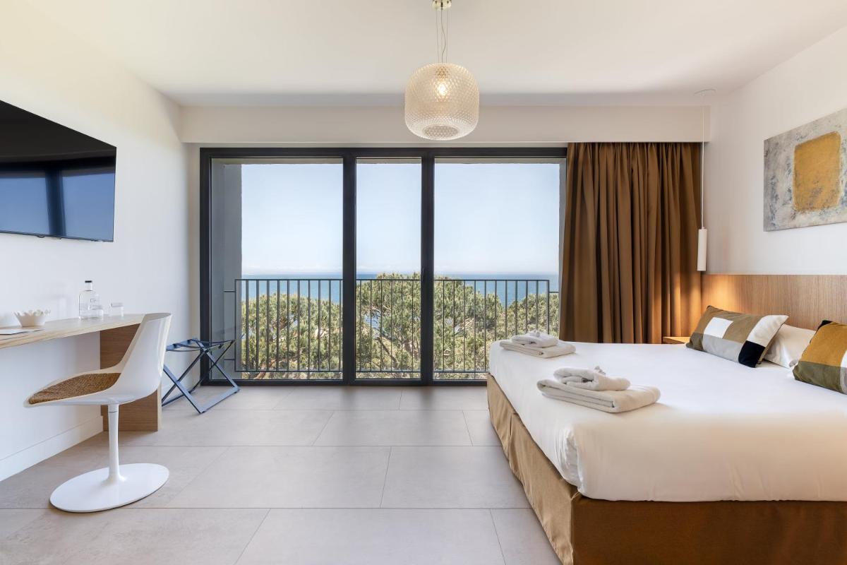 Un ou plusieurs lits dans un hébergement de l'établissement Grand Hotel Du Golfe - Spa & Restaurant