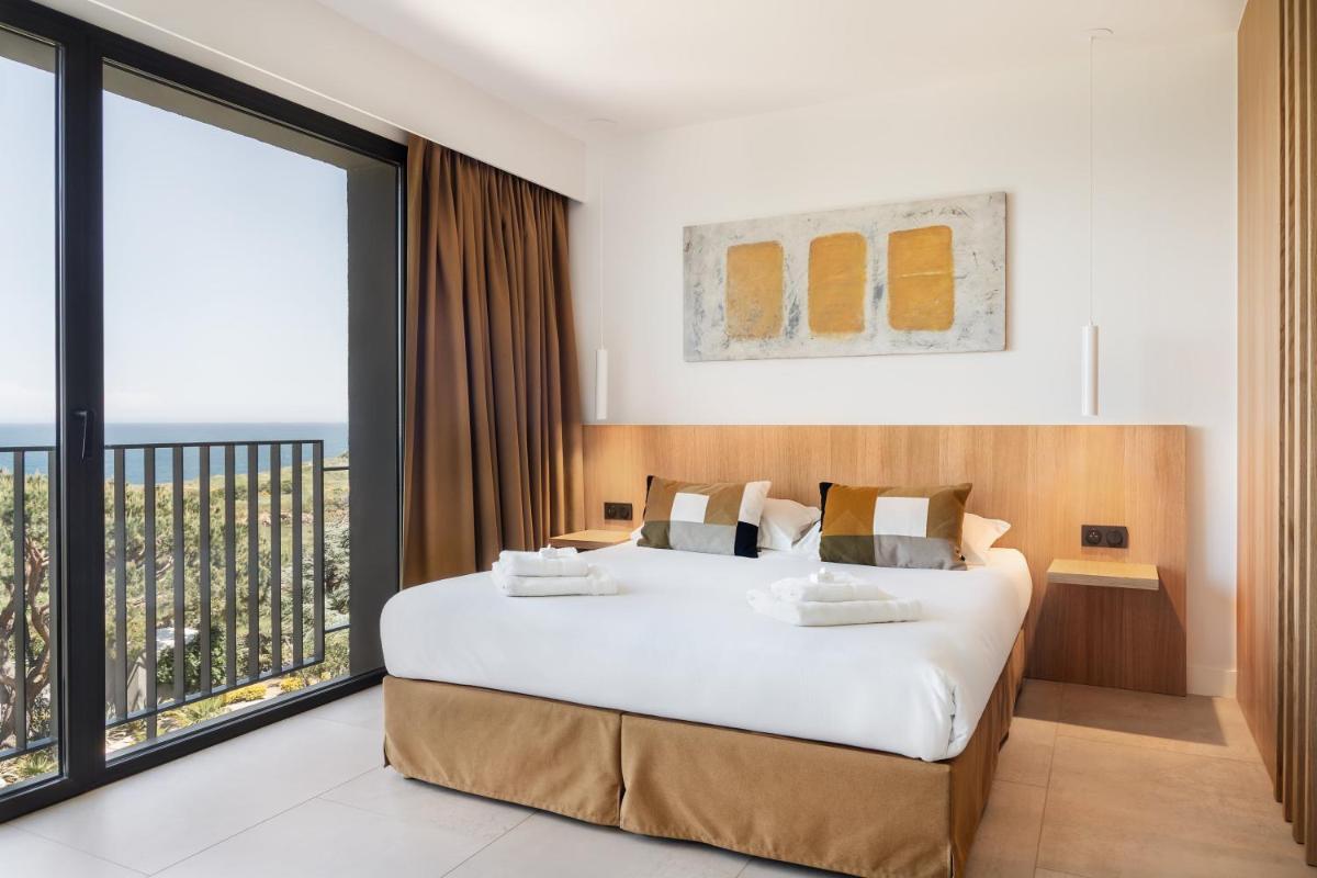 Un ou plusieurs lits dans un hébergement de l'établissement Grand Hotel Du Golfe - Spa & Restaurant