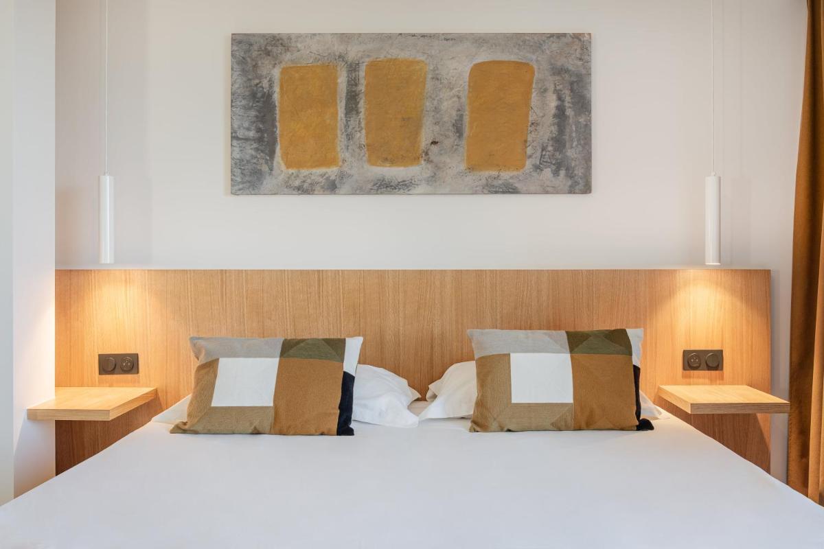 Un ou plusieurs lits dans un hébergement de l'établissement Grand Hotel Du Golfe - Spa & Restaurant