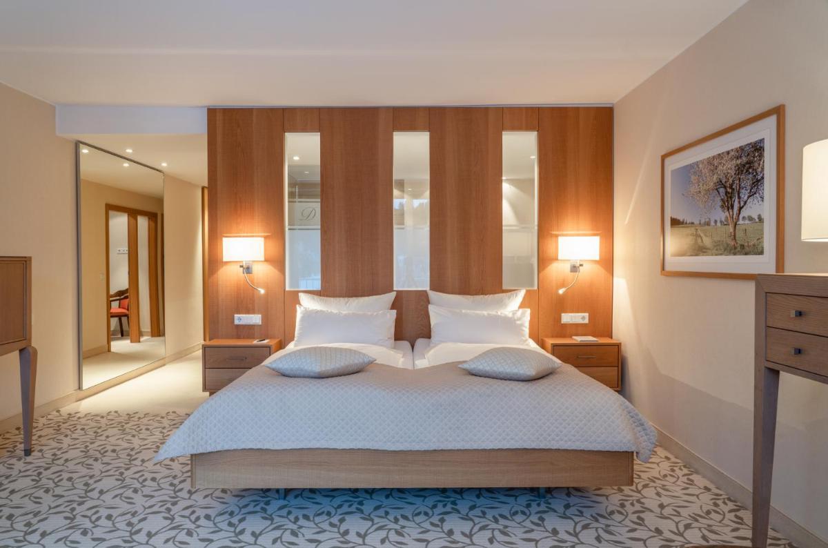 Ein Bett oder Betten in einem Zimmer der Unterkunft Hotel Deimann