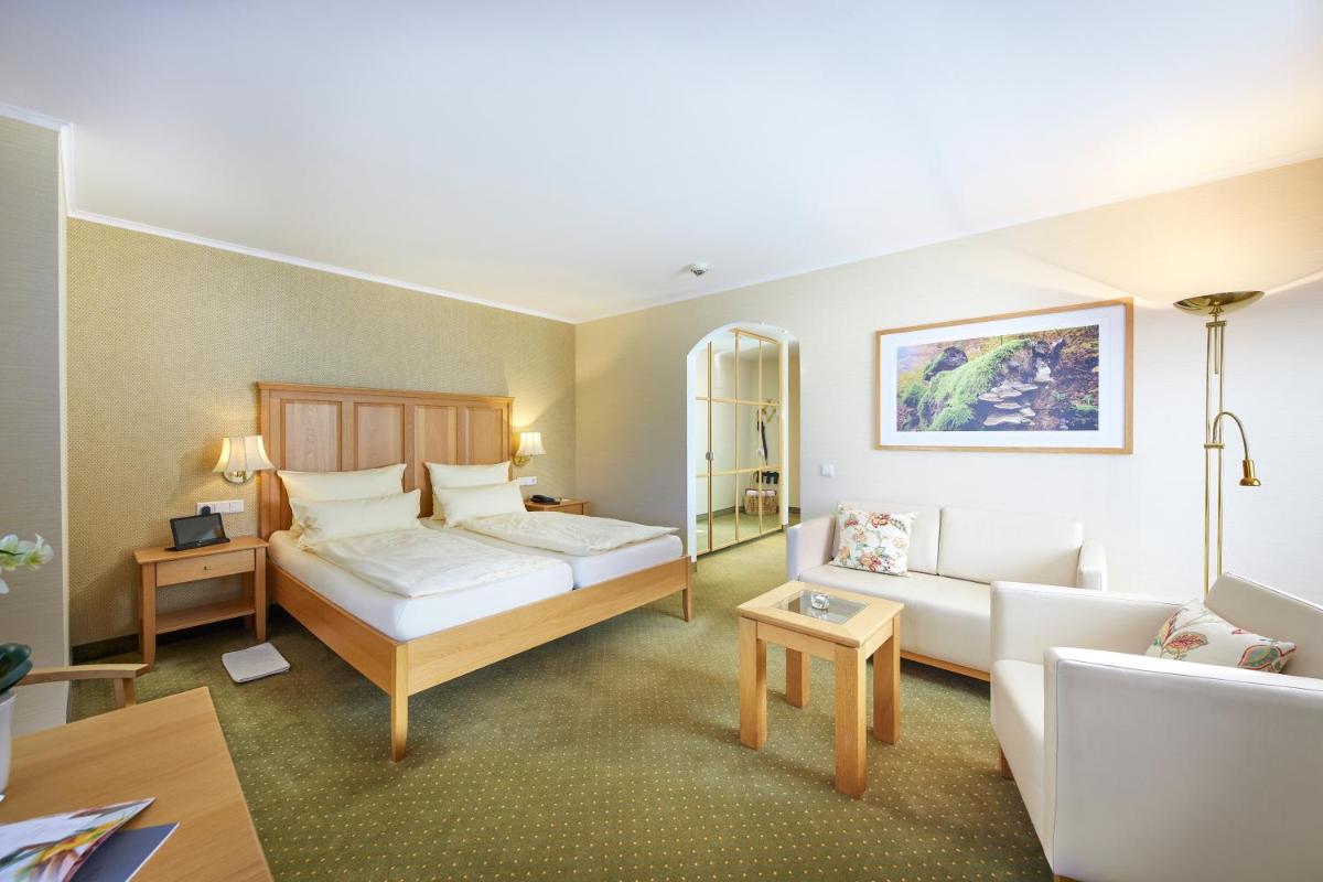 Ein Bett oder Betten in einem Zimmer der Unterkunft Hotel Deimann