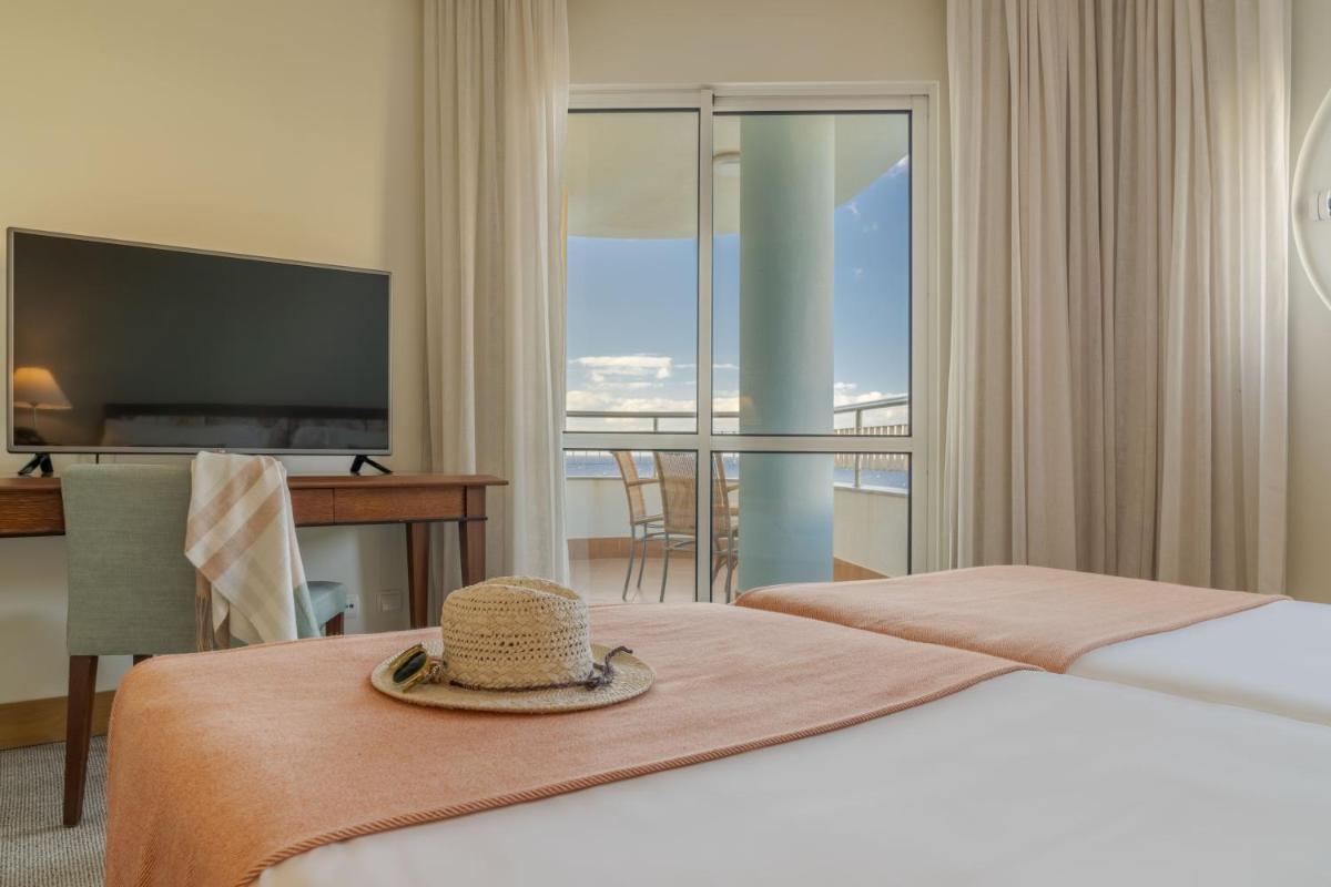 Uma cama ou camas num quarto em Pestana Grand Ocean Resort Hotel