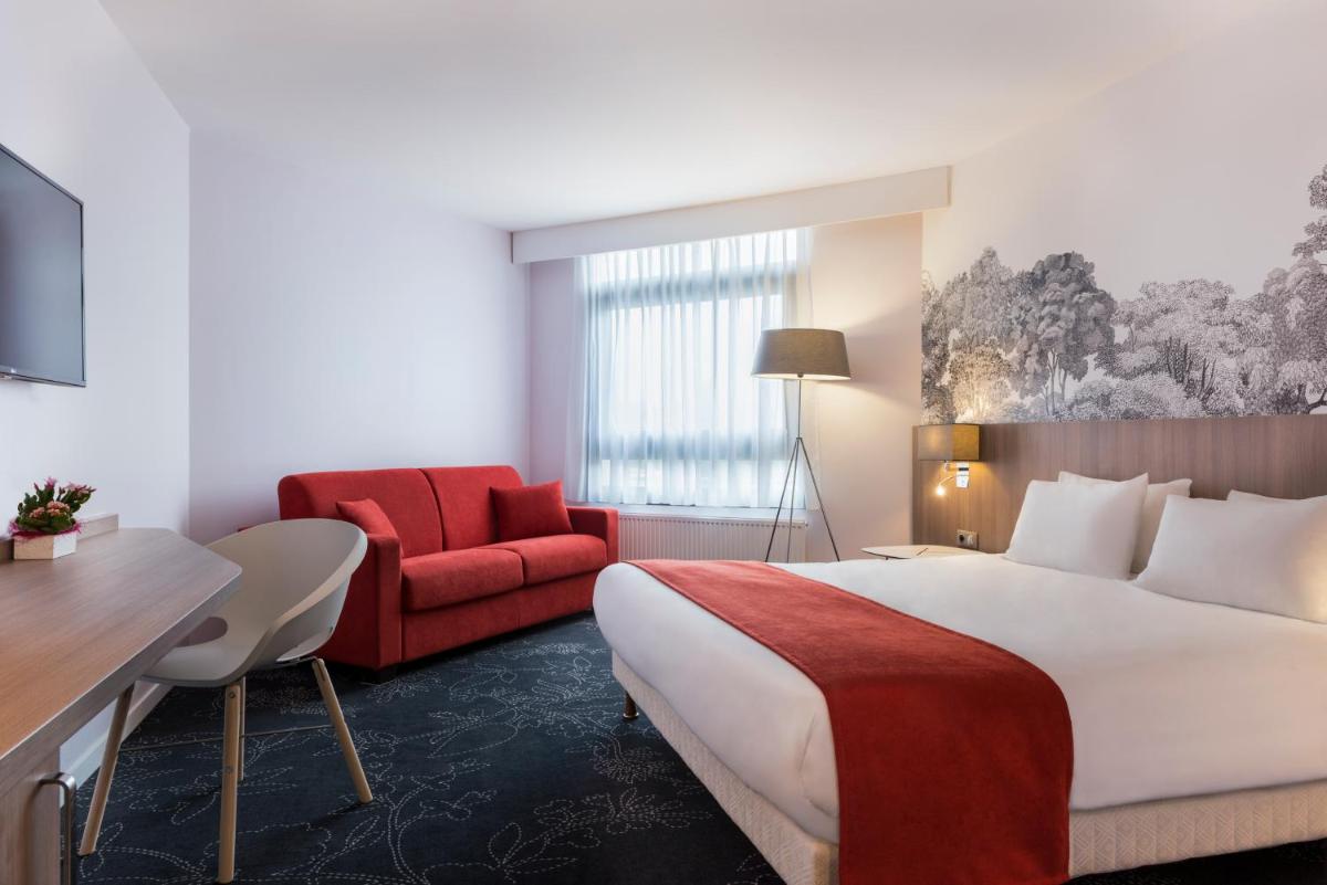 Un ou plusieurs lits dans un hébergement de l'établissement Holiday Inn Calais Coquelles by IHG