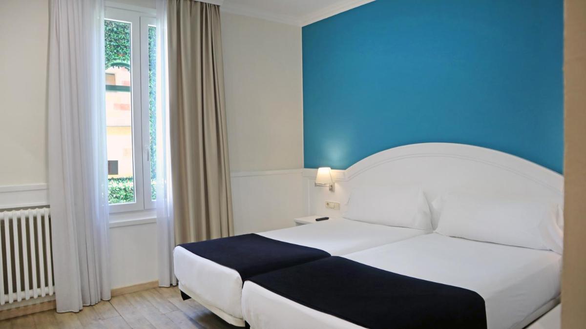 Cama o camas de una habitación en 1881 Hotel Balneario Vichy Catalan