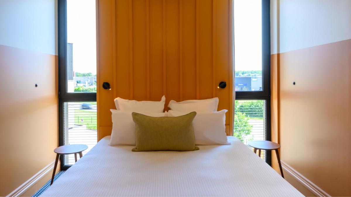 Un ou plusieurs lits dans un hébergement de l'établissement Kyriad Prestige Compiègne Hotel & Spa