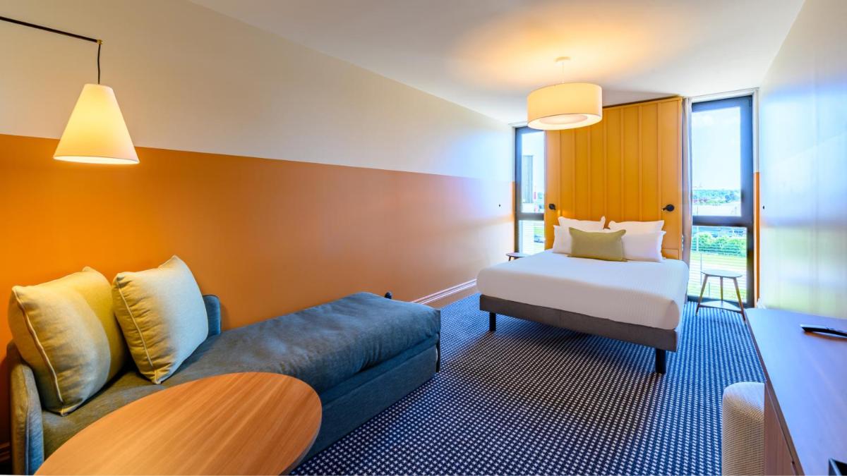 Un ou plusieurs lits dans un hébergement de l'établissement Kyriad Prestige Compiègne Hotel & Spa