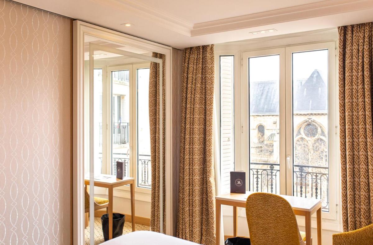 Coin salon dans l'établissement Hôtel Madison