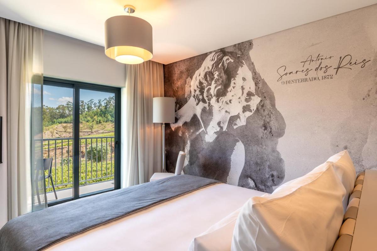 Uma cama ou camas num quarto em Vila Gale Collection Ponte de Lima