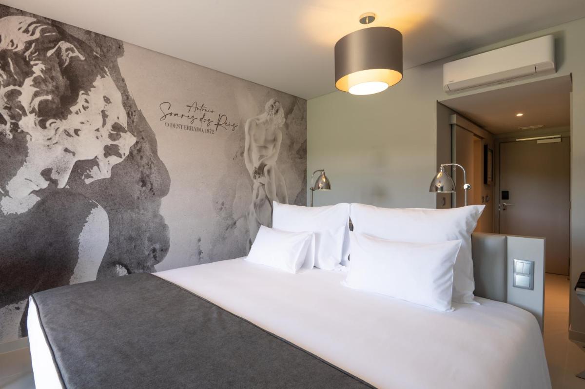 Uma cama ou camas num quarto em Vila Gale Collection Ponte de Lima