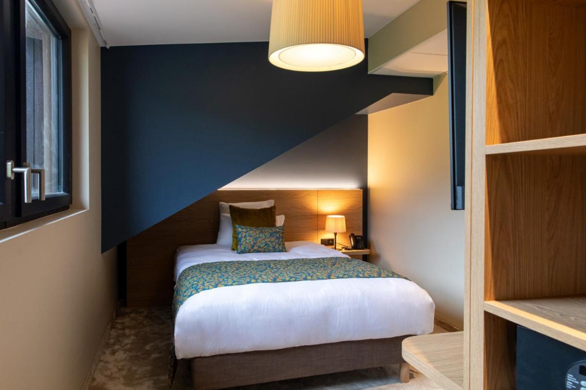 Un ou plusieurs lits dans un hébergement de l'établissement Hôtel Terra Vinum