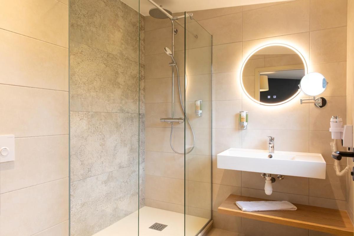 Salle de bains dans l'établissement Hôtel Terra Vinum