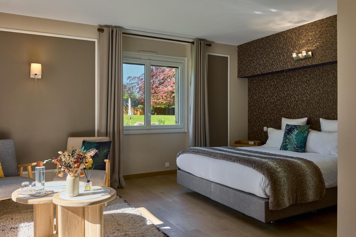 Un ou plusieurs lits dans un hébergement de l'établissement Maison Zugno Hôtel & Spa