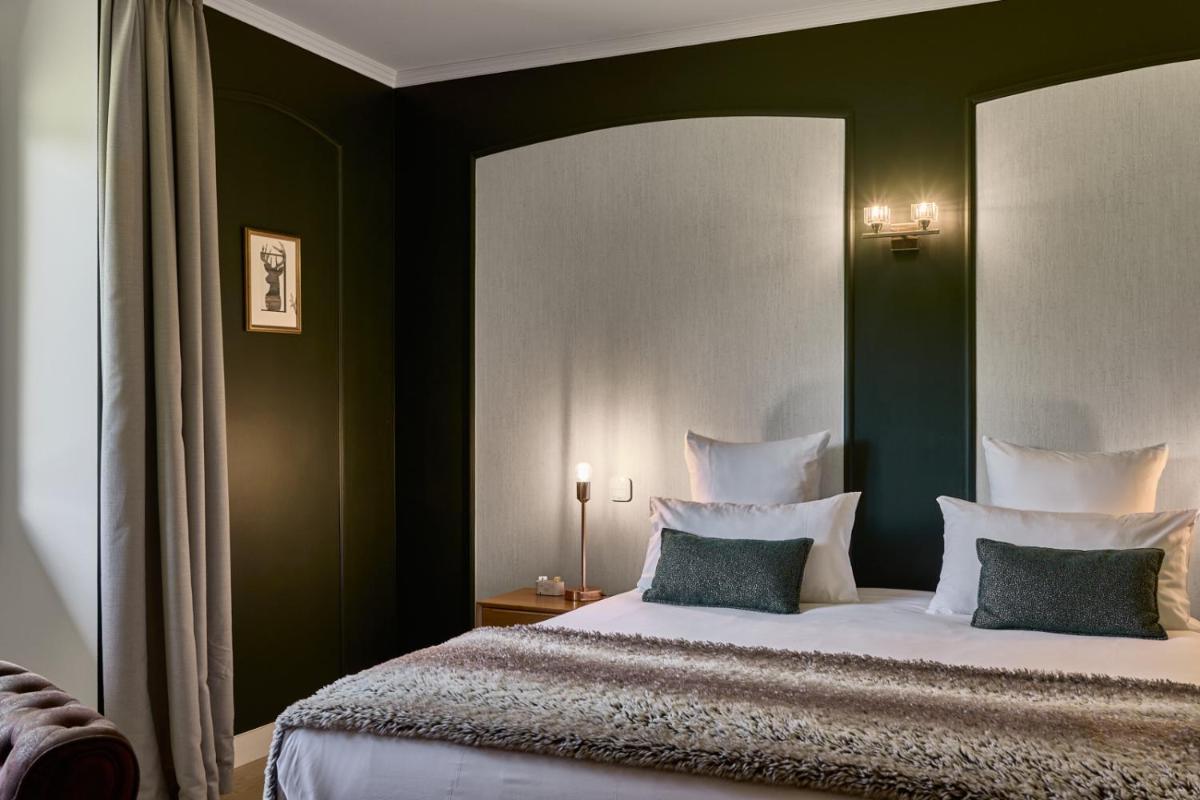 Un ou plusieurs lits dans un hébergement de l'établissement Maison Zugno Hôtel & Spa