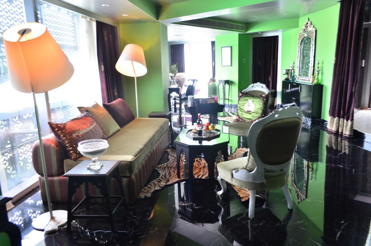 a living room with a couch and a table at The Park Hyderabad, Banjara Hills near Hussain Sagar Lake in Hyderabad a living room with a couch and a table at The Park Hyderabad, Banjara Hills near Hussain Sagar Lake in Hyderabad