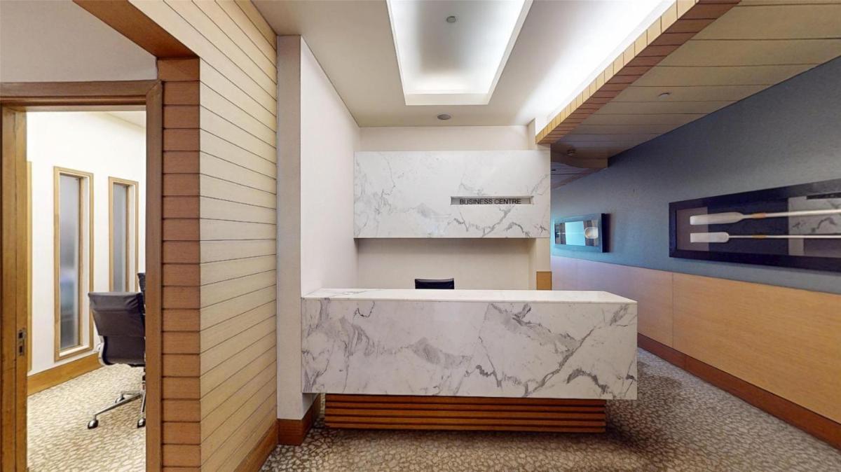 a bathroom with a marble counter and a sink at Radisson Blu Hotel, Nagpur in Nagpur