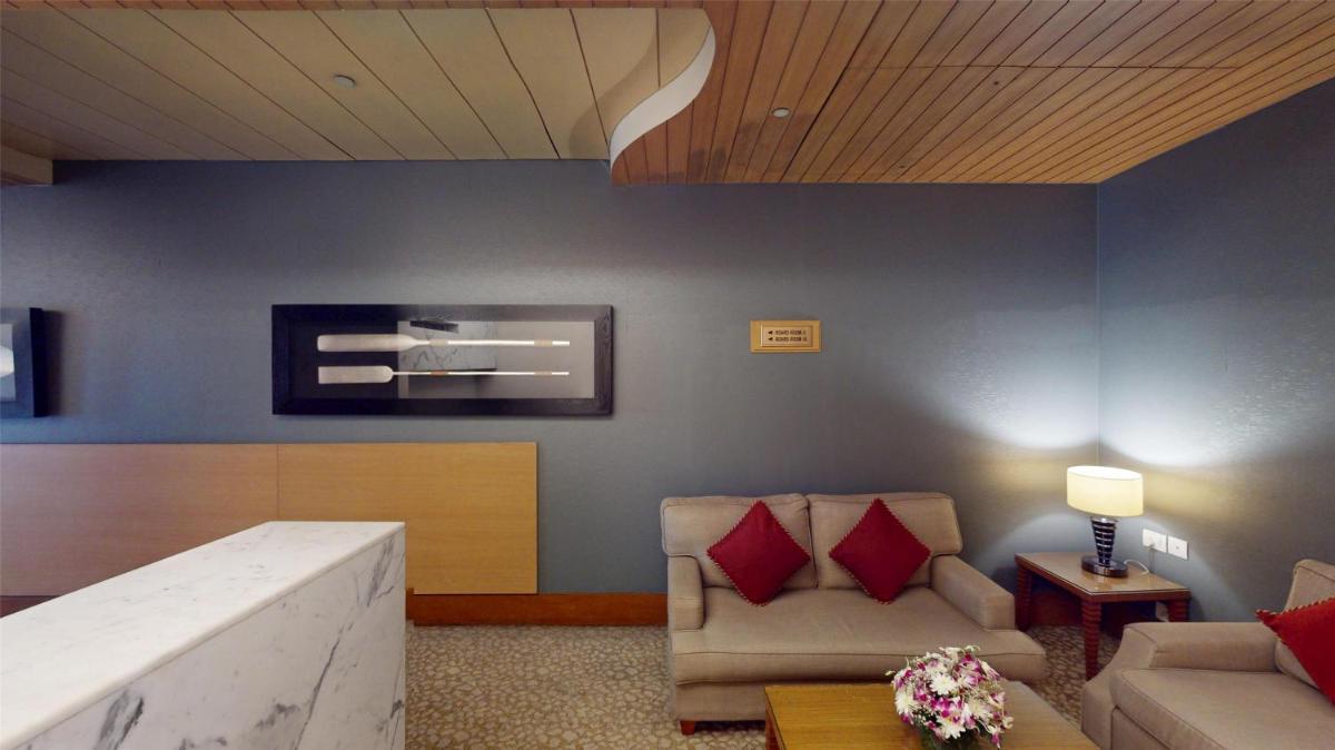 a living room with two chairs and a couch at Radisson Blu Hotel, Nagpur in Nagpur
