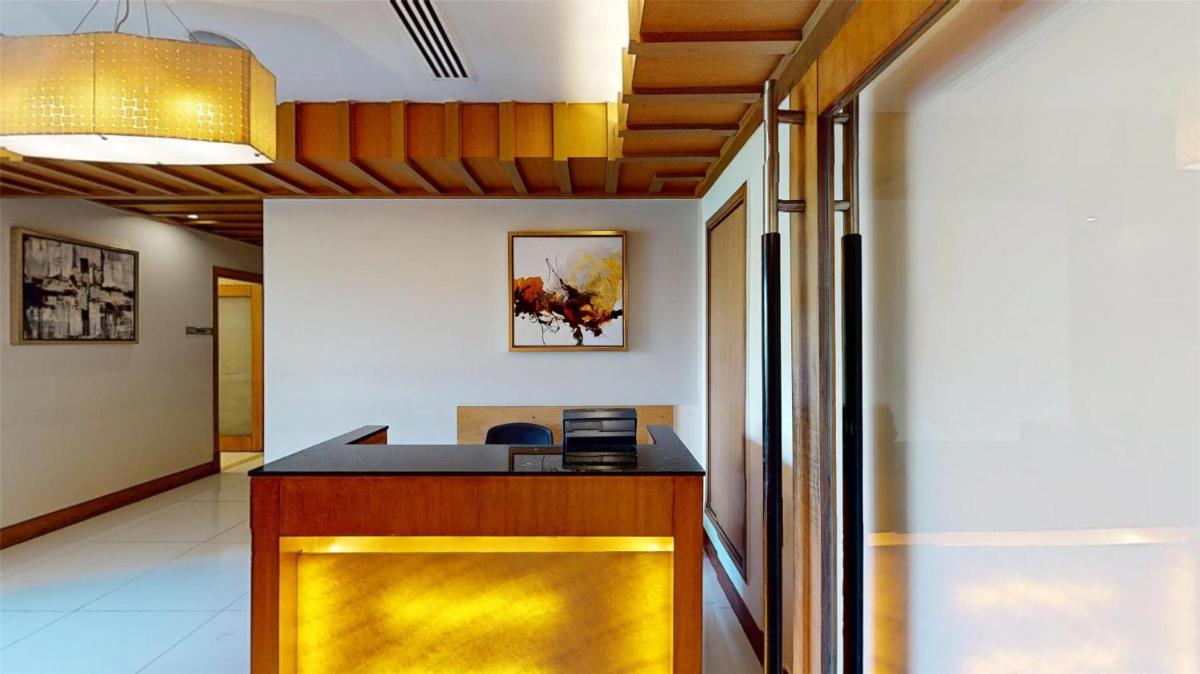 an office with a yellow counter in a room at Radisson Blu Hotel, Nagpur in Nagpur