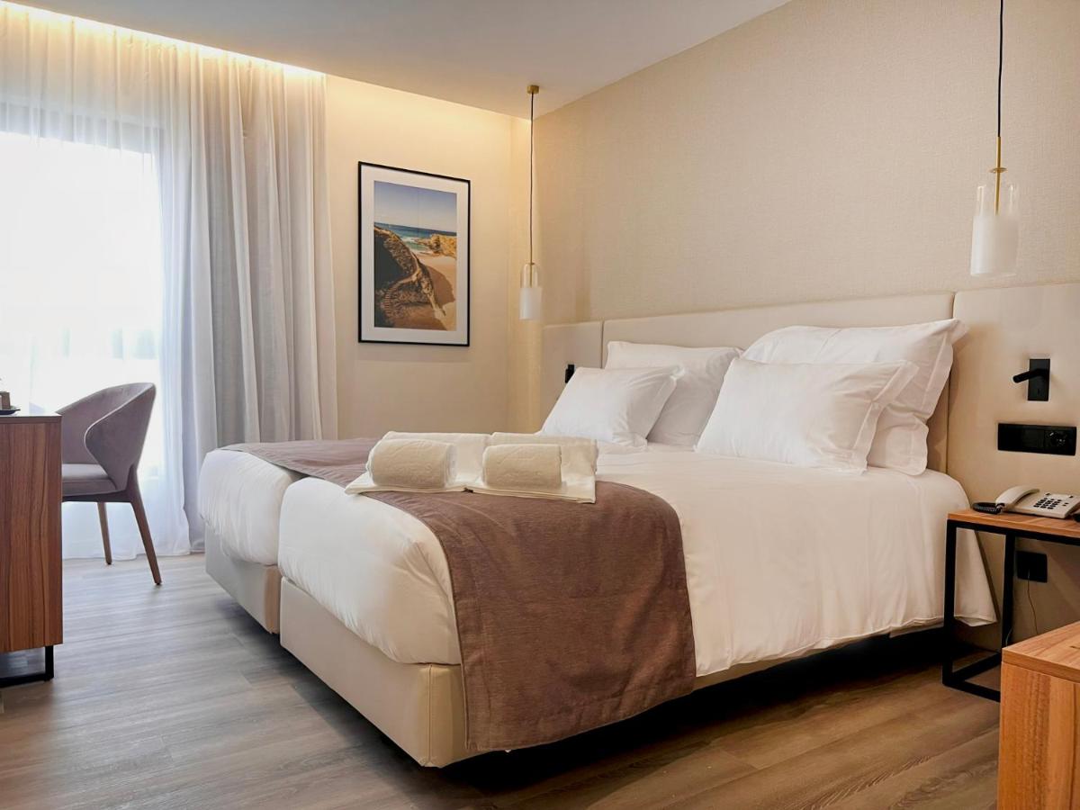 Uma cama ou camas num quarto em AP Sines - Costa Alentejana