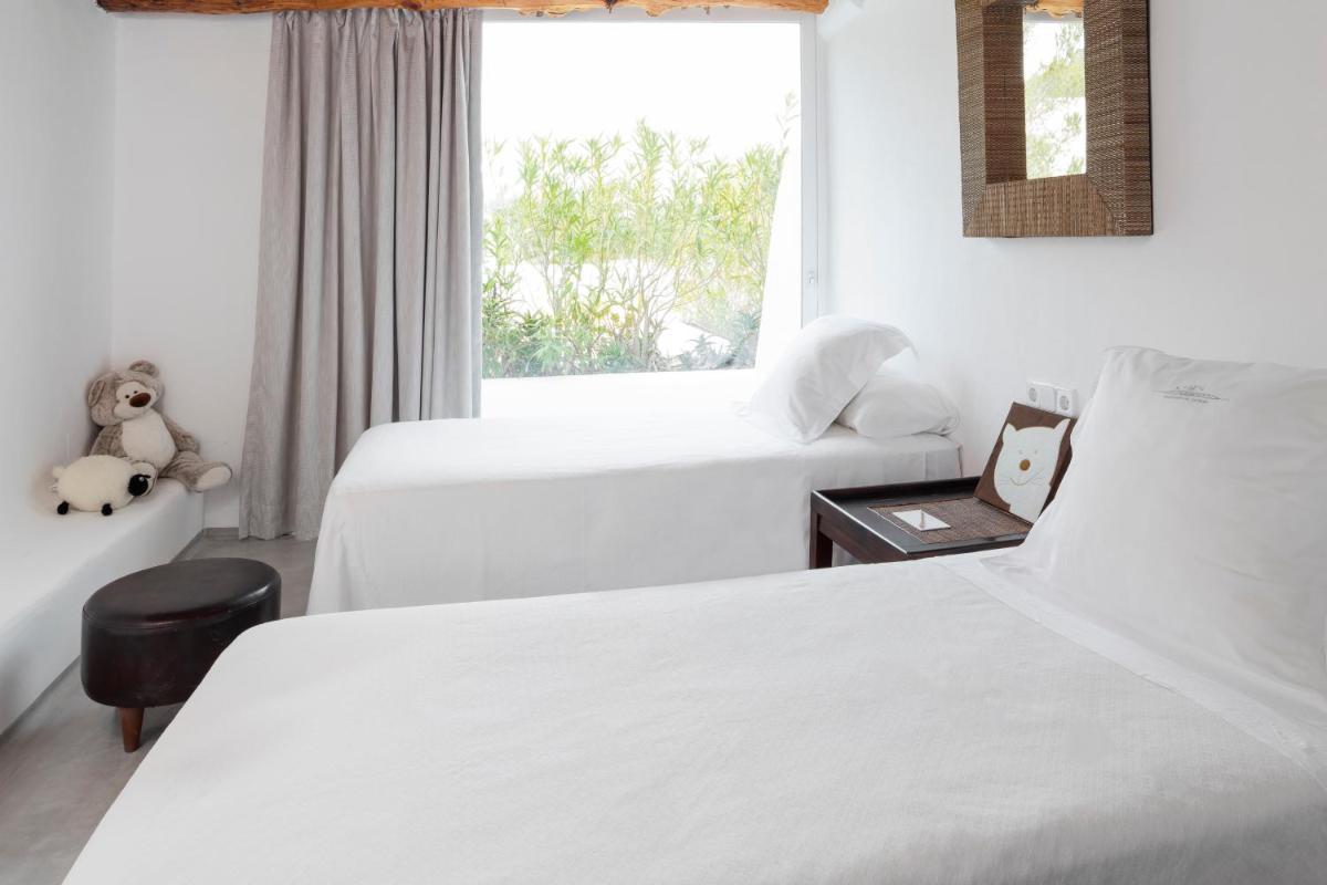 Cama o camas de una habitación en Hacienda Na Xamena, Ibiza