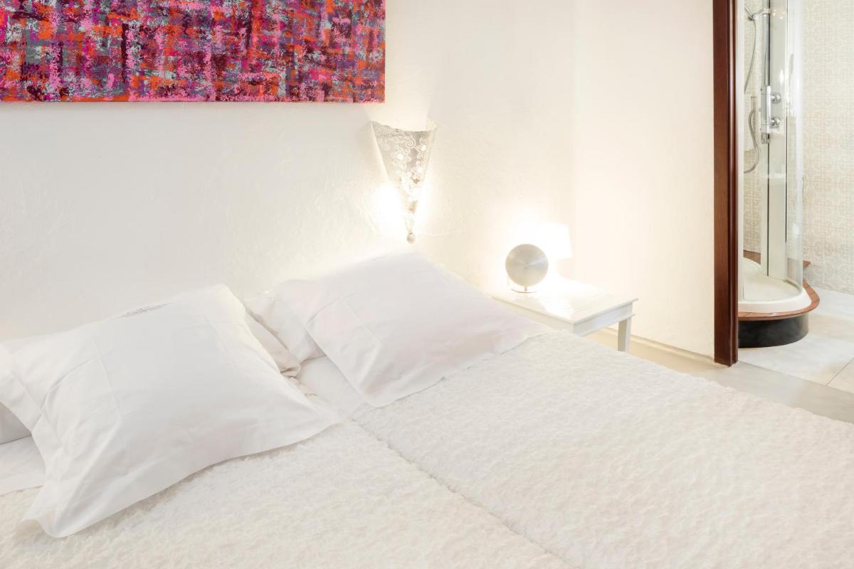Cama o camas de una habitación en Hacienda Na Xamena, Ibiza