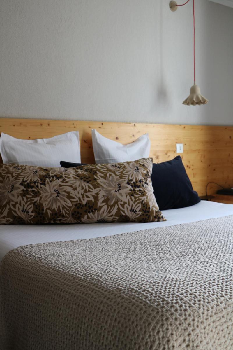 Un ou plusieurs lits dans un hébergement de l'établissement Hotel Spa Azteca Barcelonnette