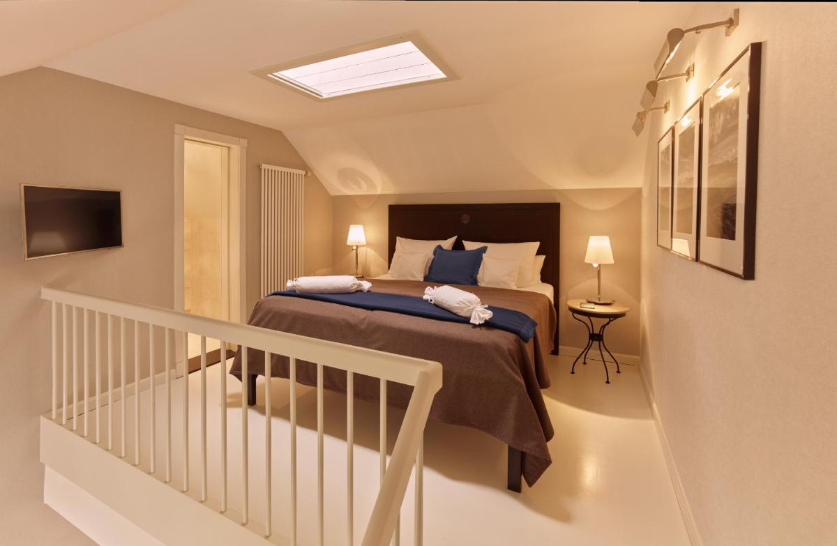 Ein Bett oder Betten in einem Zimmer der Unterkunft Söl'ring Hof