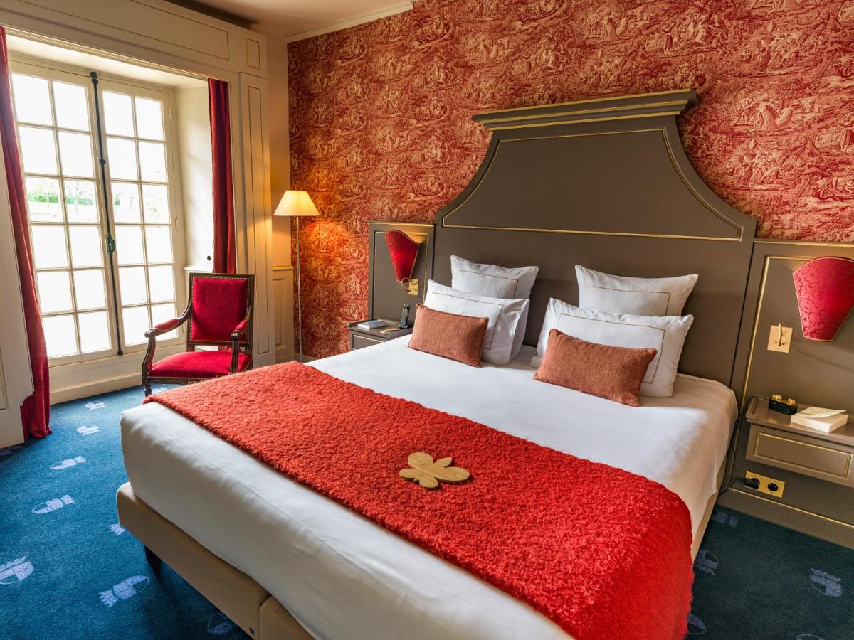 Un ou plusieurs lits dans un hébergement de l'établissement Chateau d'Audrieu