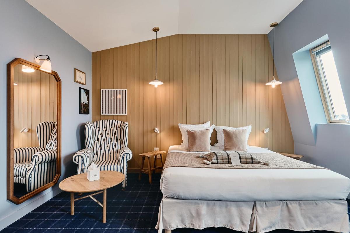 Un ou plusieurs lits dans un hébergement de l'établissement Hôtel de la Mer & Spa
