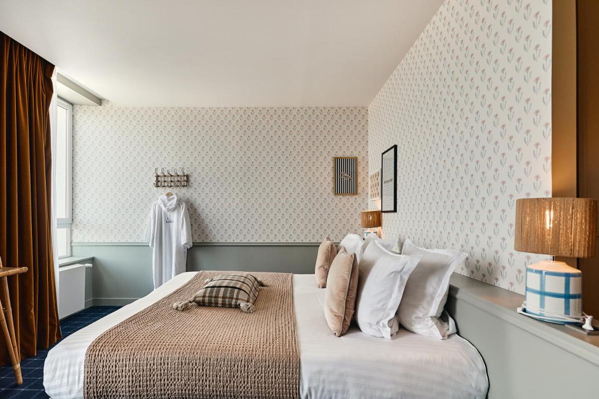 Un ou plusieurs lits dans un hébergement de l'établissement Hôtel de la Mer & Spa