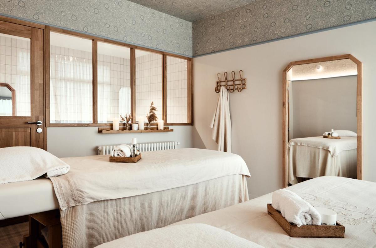 Un ou plusieurs lits dans un hébergement de l'établissement Hôtel de la Mer & Spa