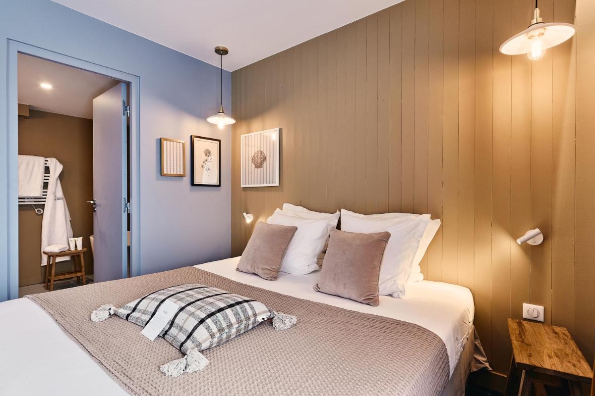 Un ou plusieurs lits dans un hébergement de l'établissement Hôtel de la Mer & Spa
