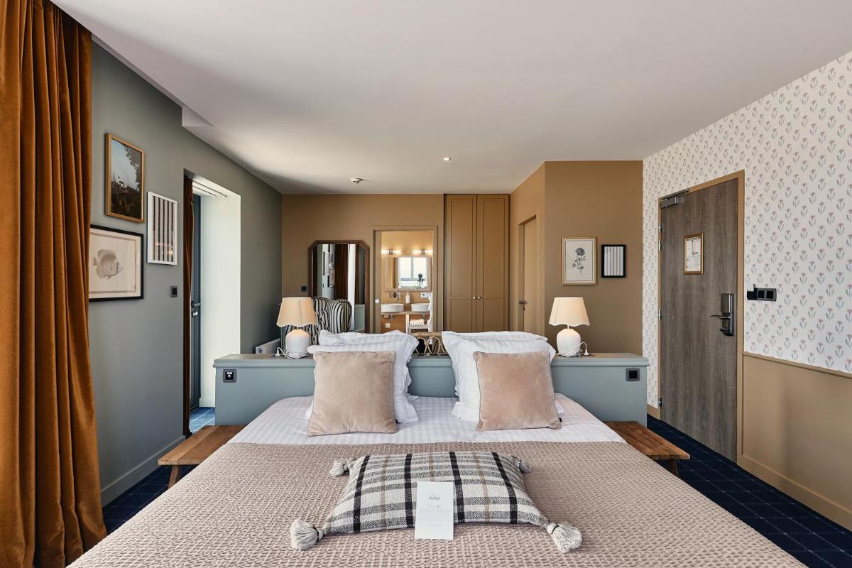 Un ou plusieurs lits dans un hébergement de l'établissement Hôtel de la Mer & Spa