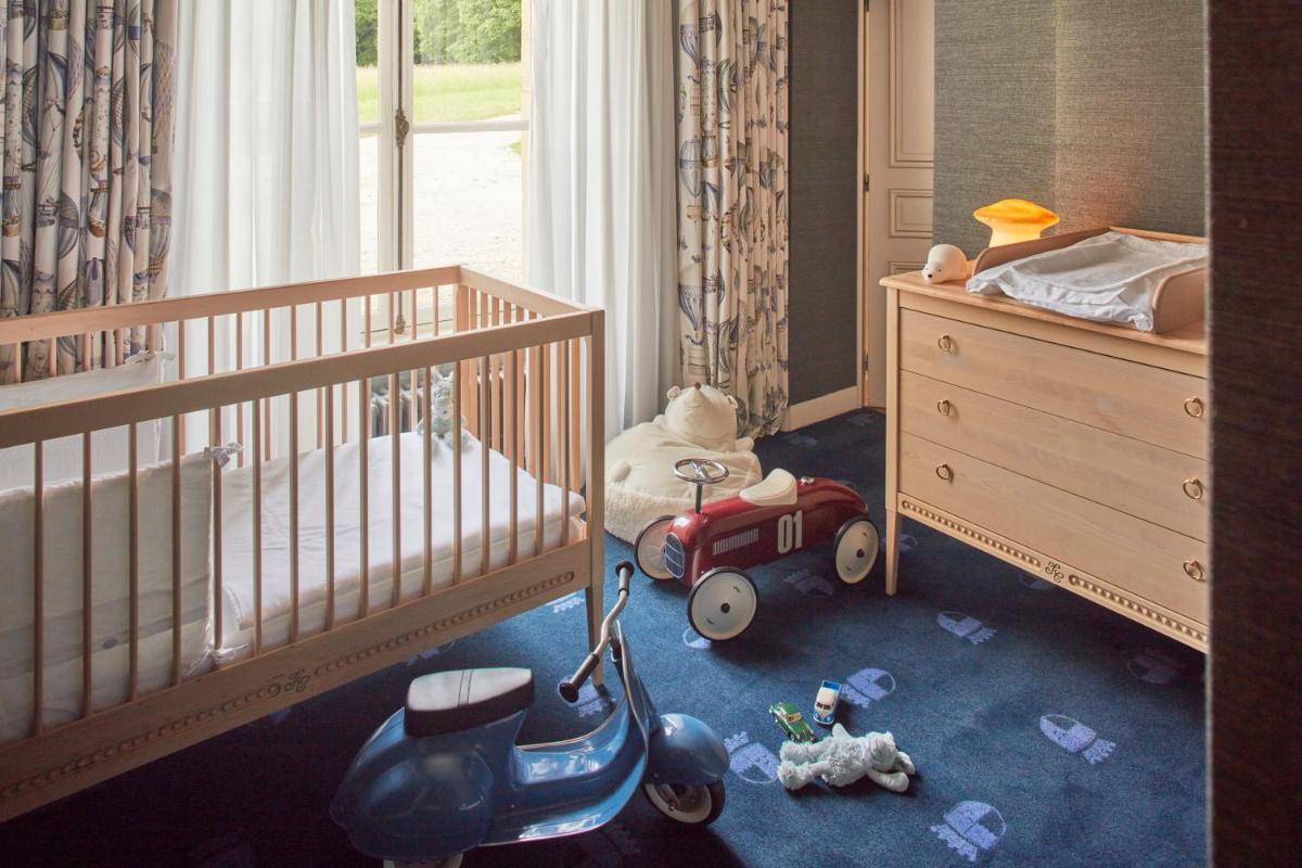 Un ou plusieurs lits dans un hébergement de l'établissement Chateau d'Audrieu